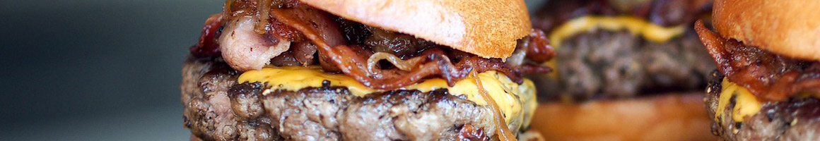 Eating American (Traditional) Burger Pub Food at Brick House Tavern + Tap restaurant in Galveston, TX.
